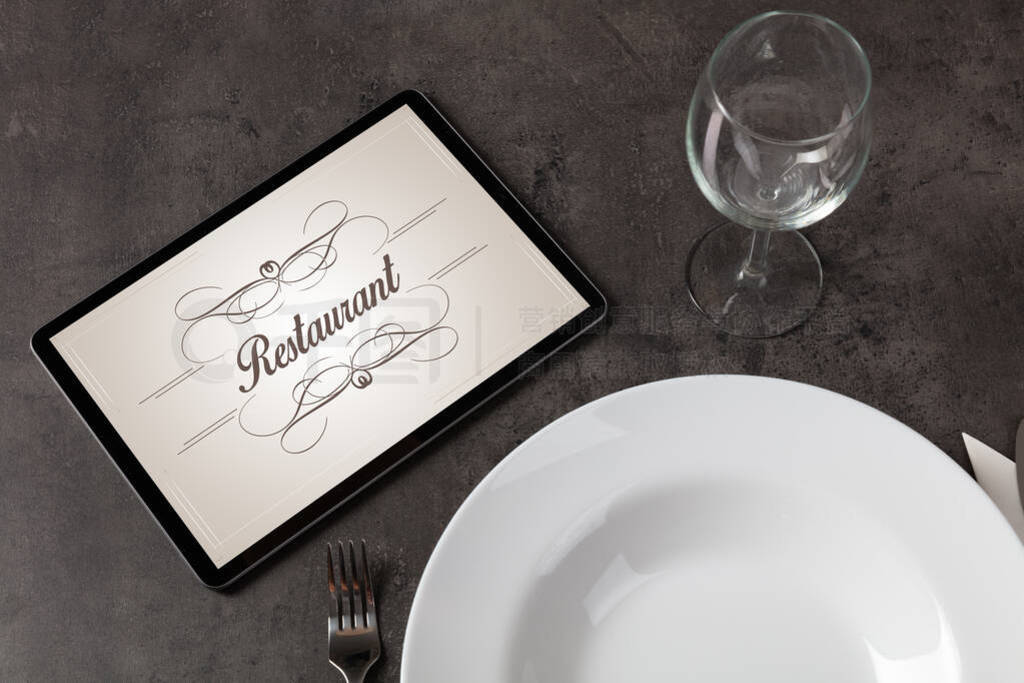 Elegant laid table with stylish restaurant logo