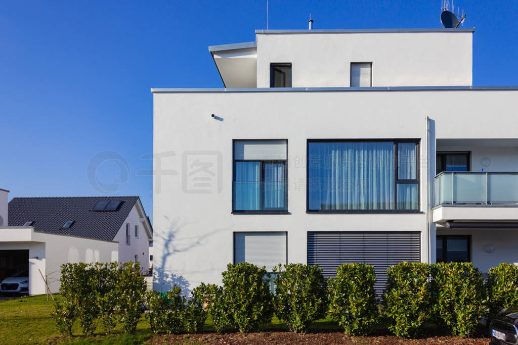 modern house building with green bushes