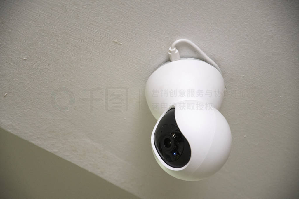 CCTV security camera on wall in the home