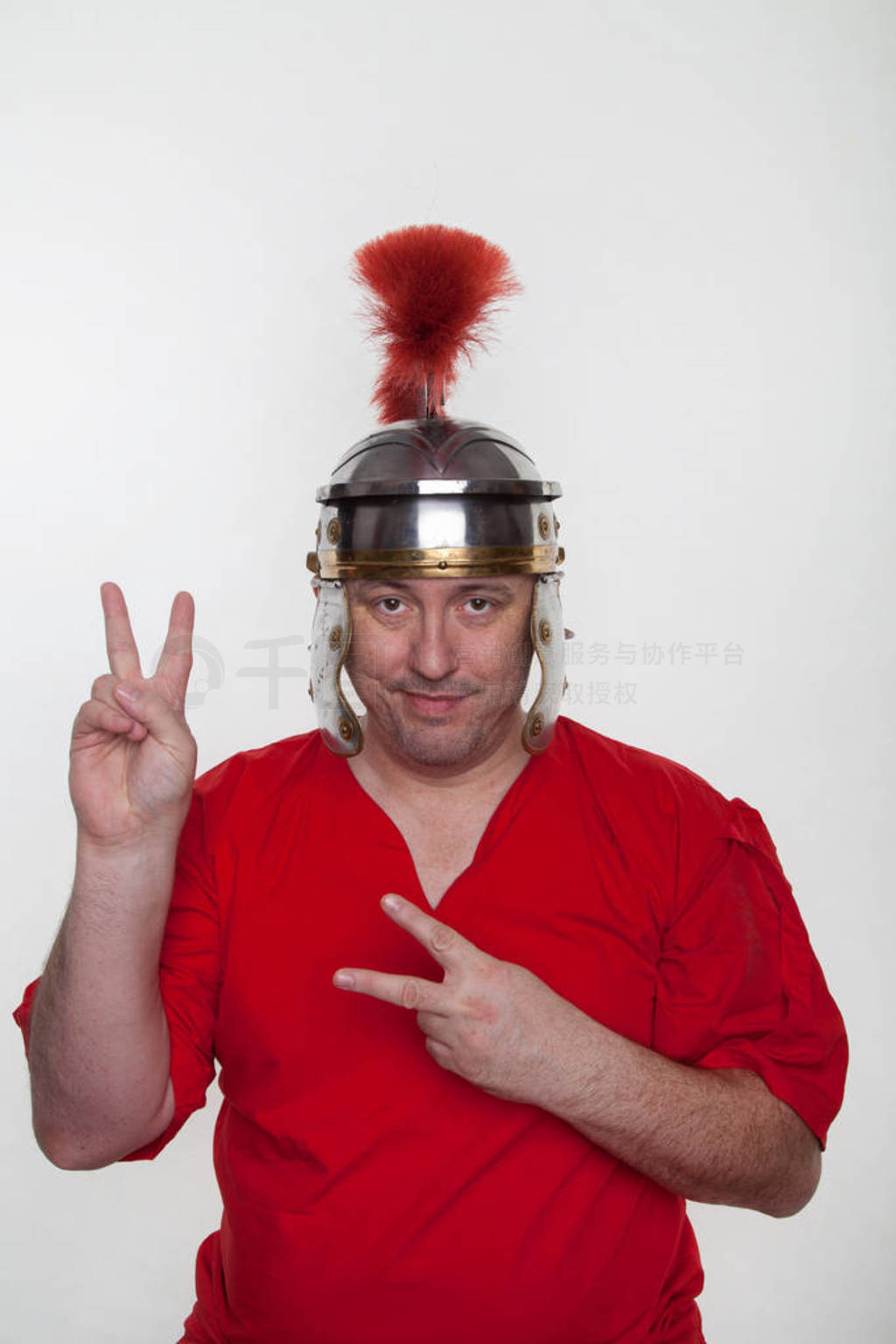 A roman soldier shows peace sign