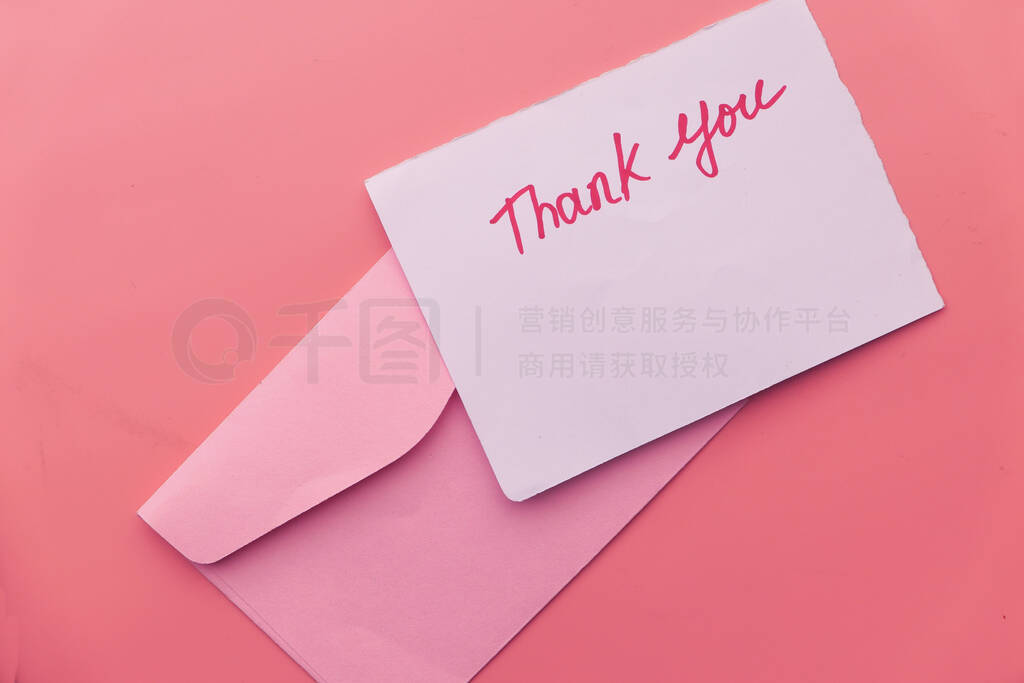 thank you letter and envelope on pink background