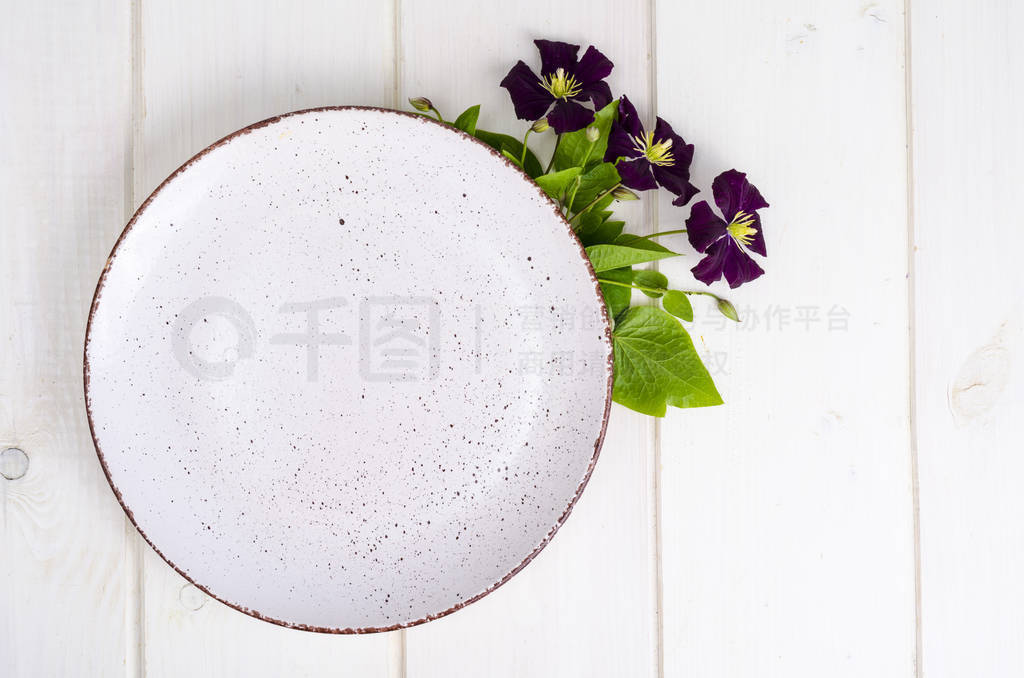 Plate with violet flowers, mock up for menu.