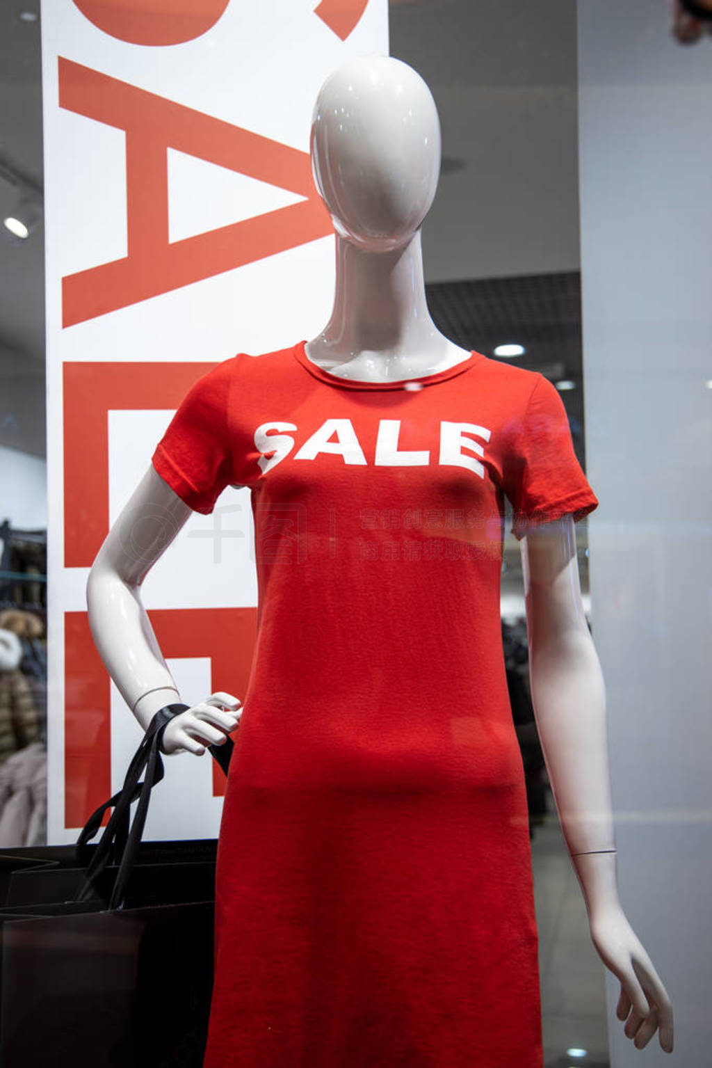 some mannequins wear a red shirt with the word