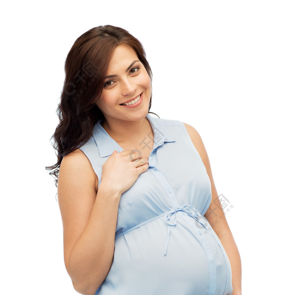怀孕孕产人和期望的概念幸福的孕妇抚摸她的大肚子在白色的背景