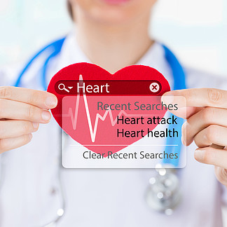 醫生抱著心臟和心跳符號與搜索引擎和心臟病發作的跡象