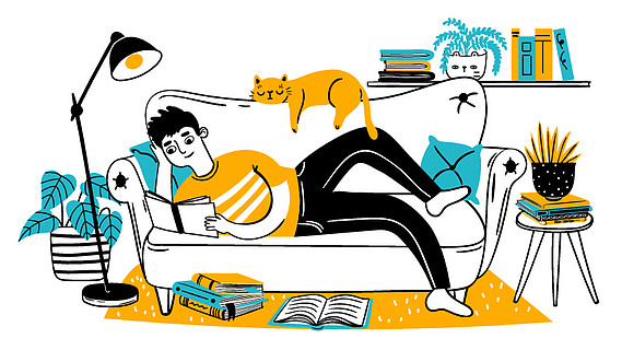 男人在沙发上看书轻松的成人在家与猫在沙发上阅读