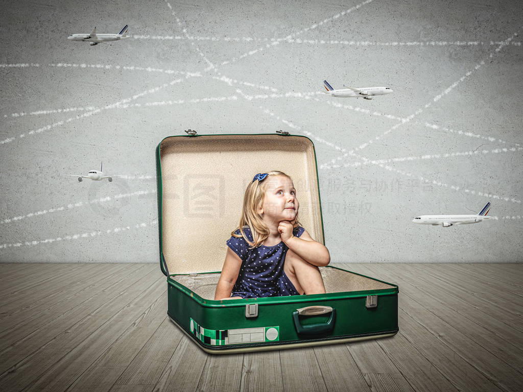 little girl sitting Inside an old suitcase imagines adventures