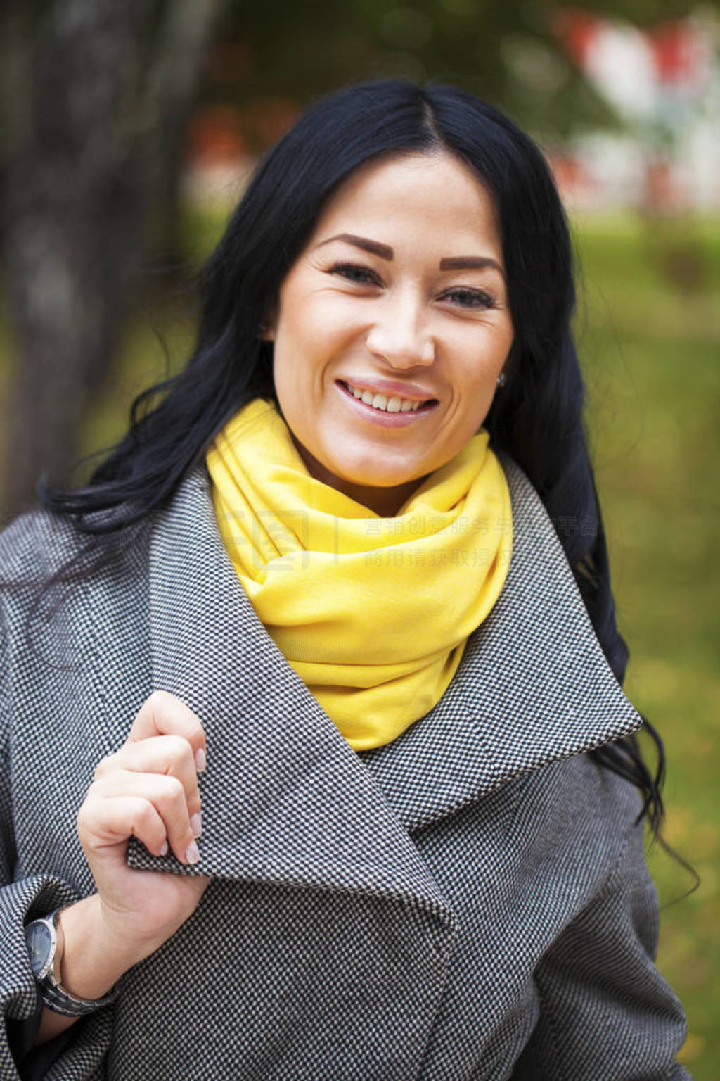 Portrait of a young beautiful woman in gray coat