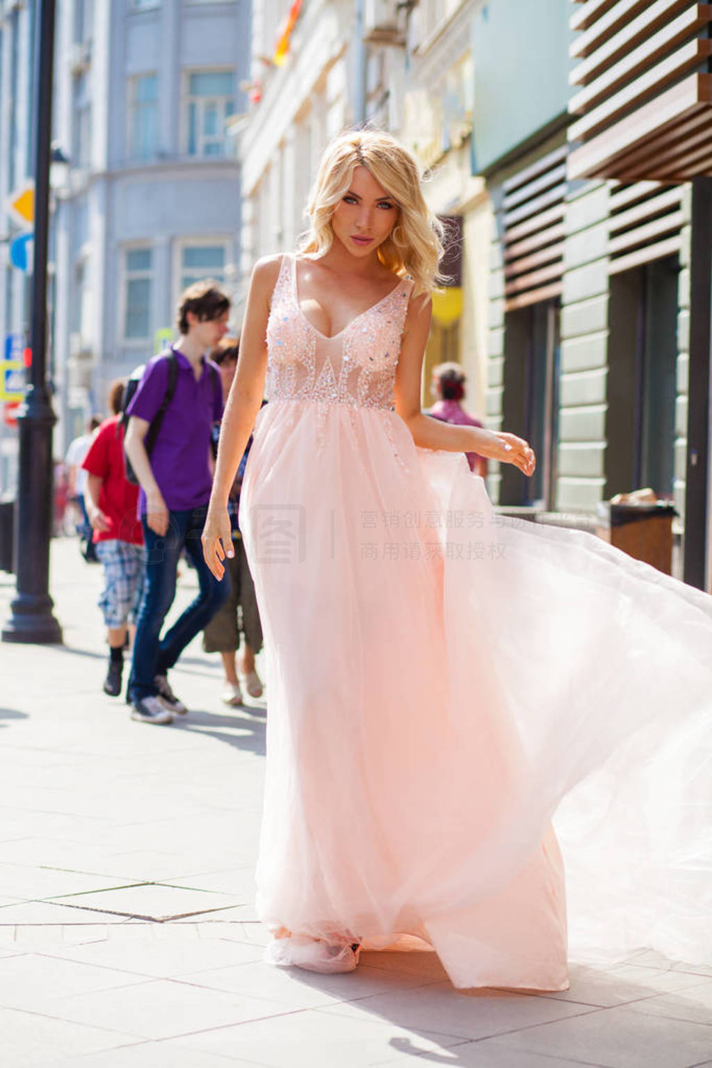 Portrait in full growth, young beautiful brunette woman in pink