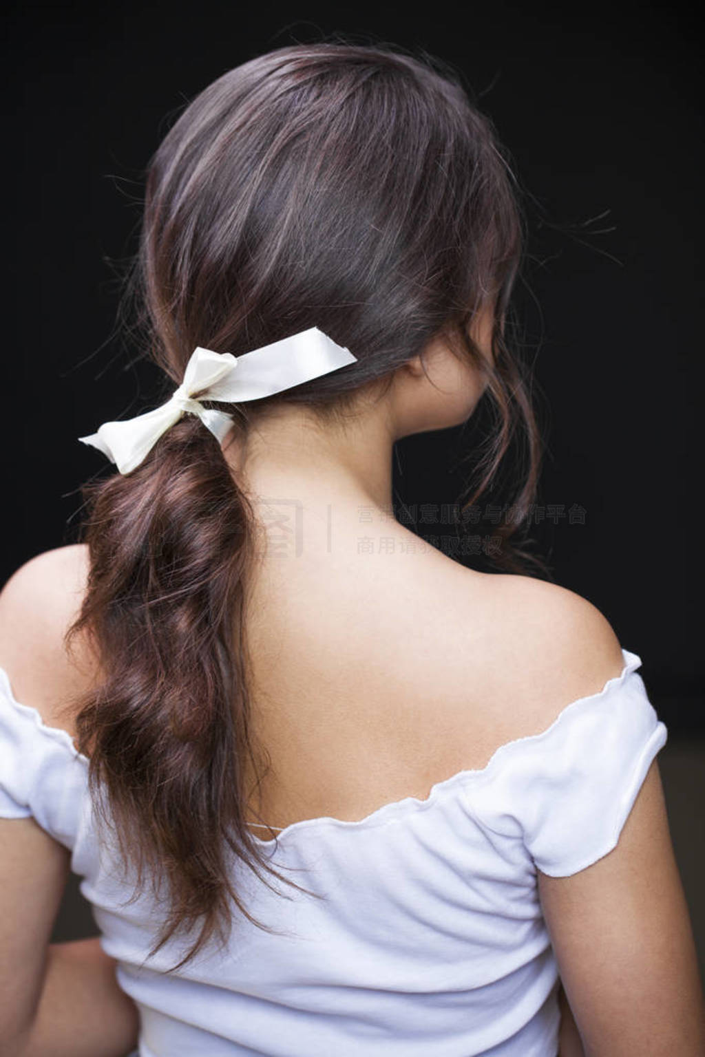 Hair back, young woman with open shoulders