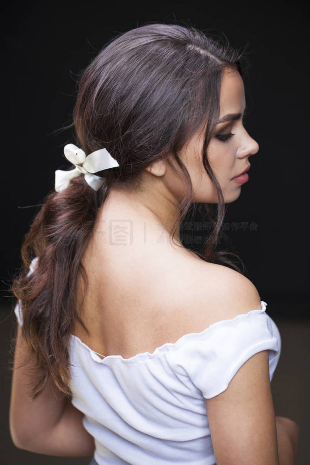 Hair back, young woman with open shoulders
