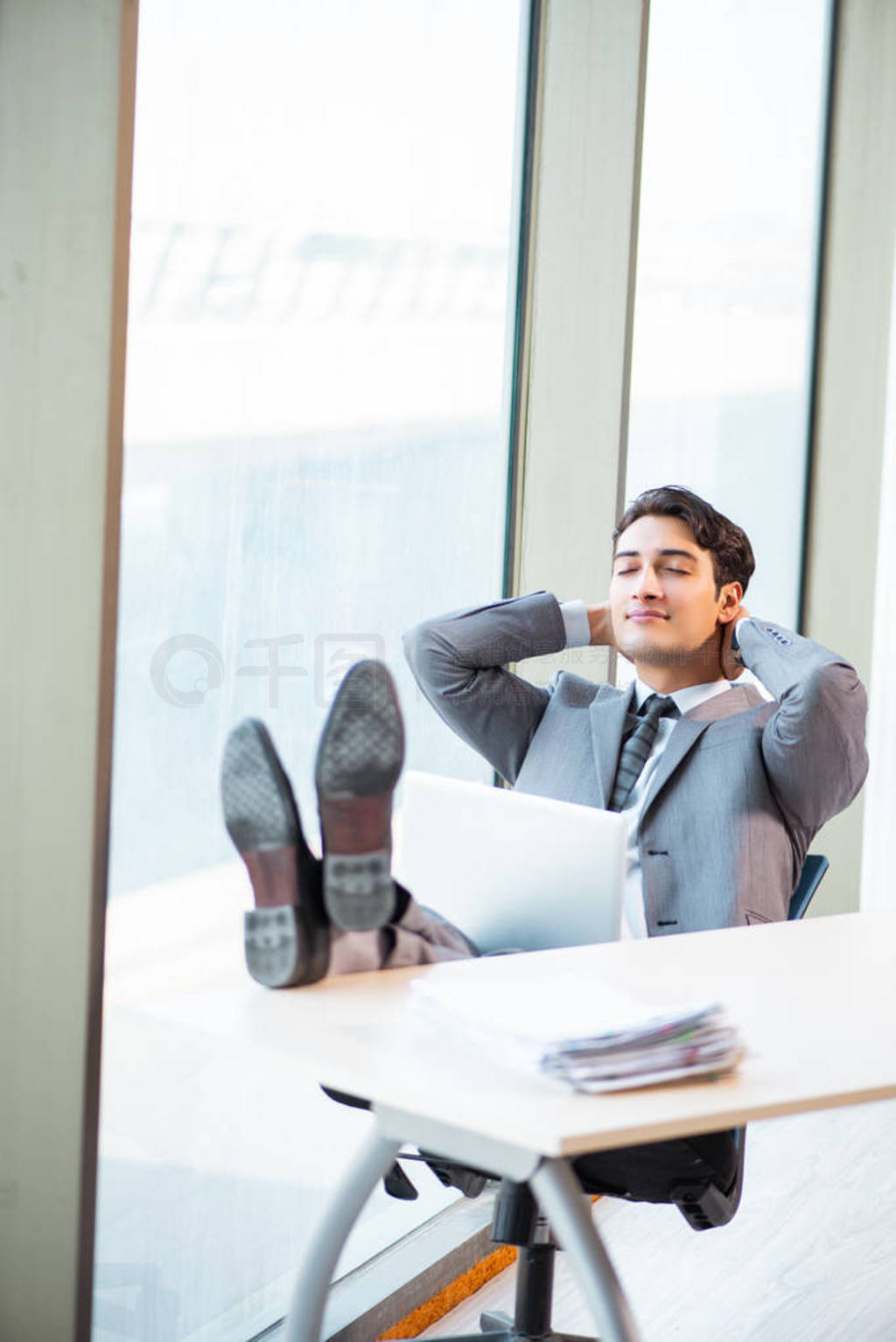 Young successful businessman working at the office