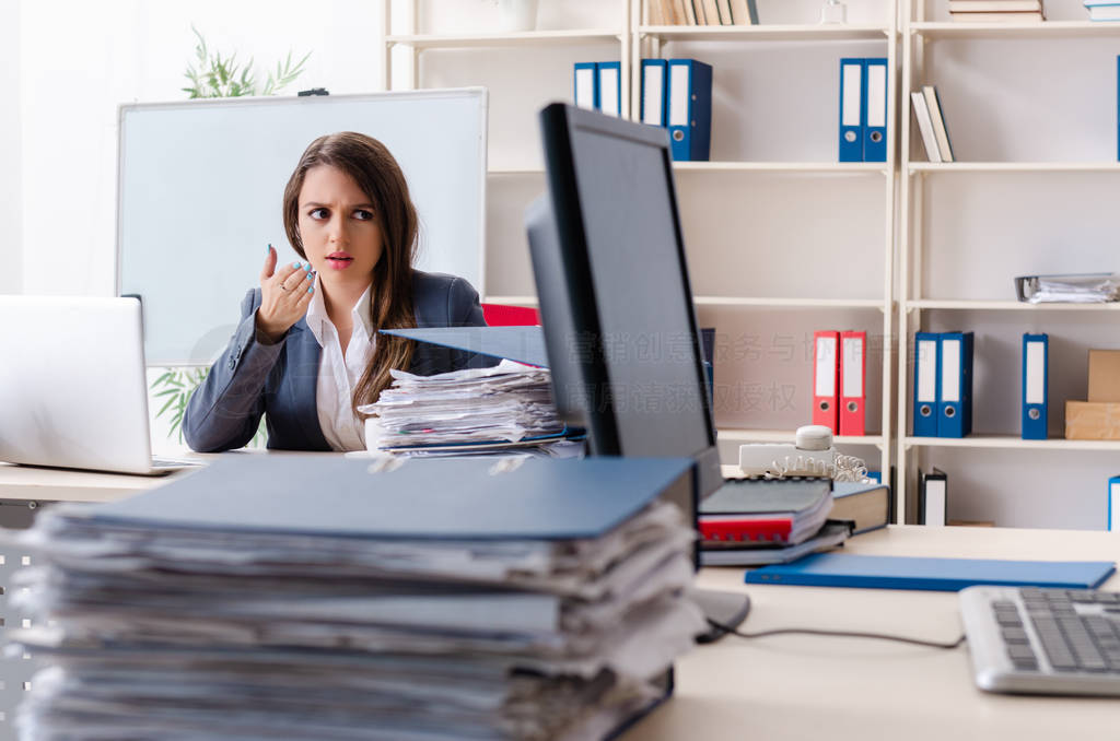 Beautiful female employee unhappy with excessive work