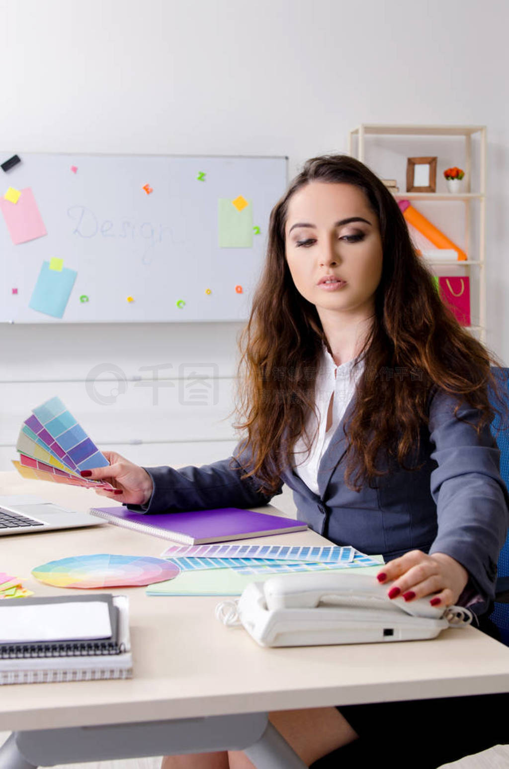 Young female designer working in the office