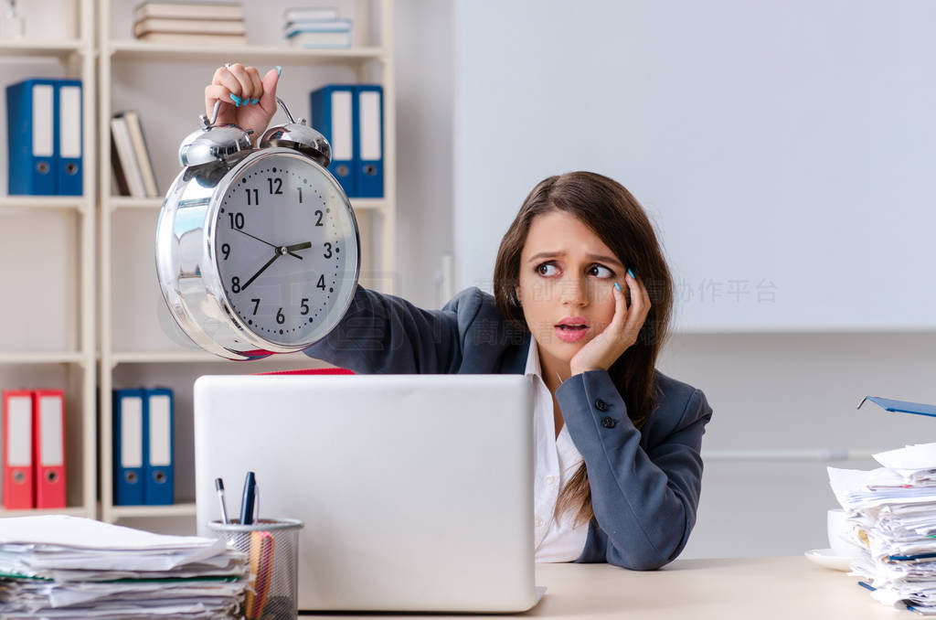 Beautiful female employee unhappy with excessive work