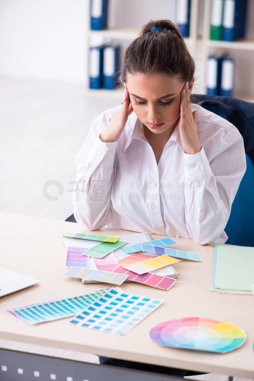 Female beautiful designer working in the office