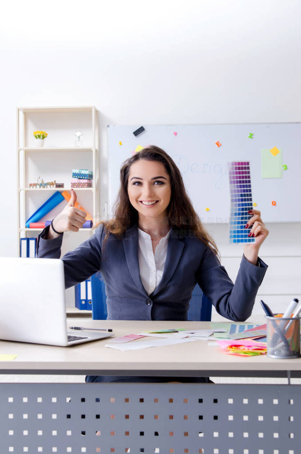 Young female designer working in the office