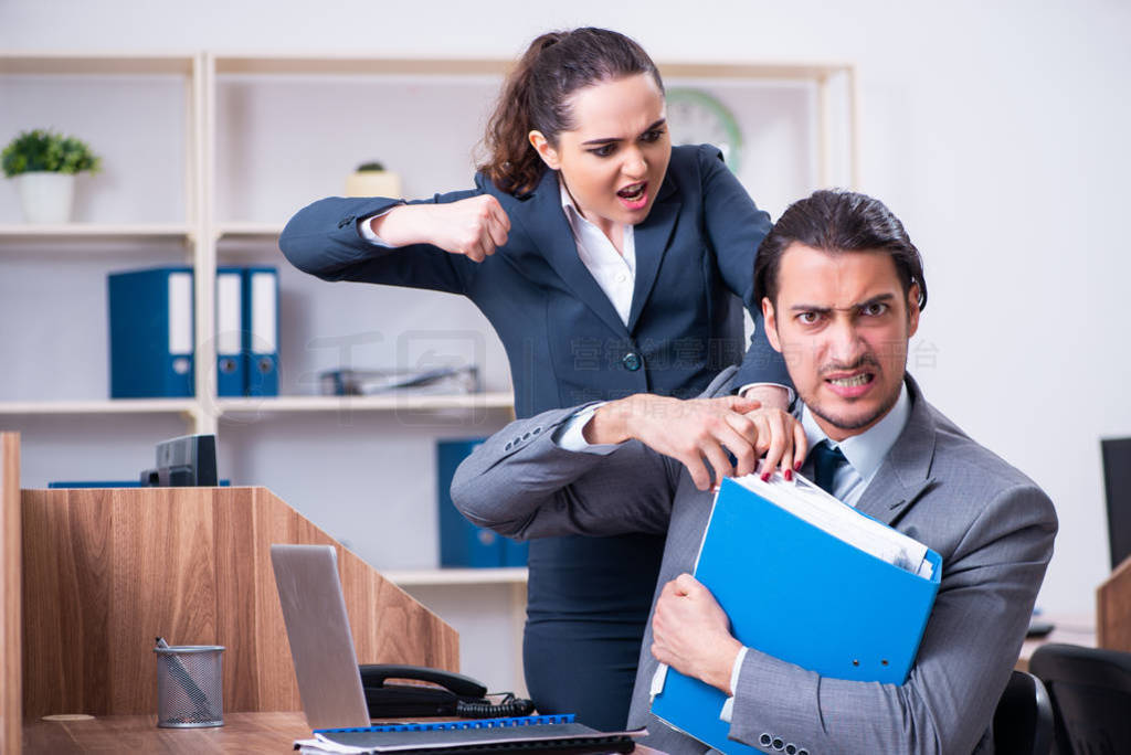 Two employees working in the office