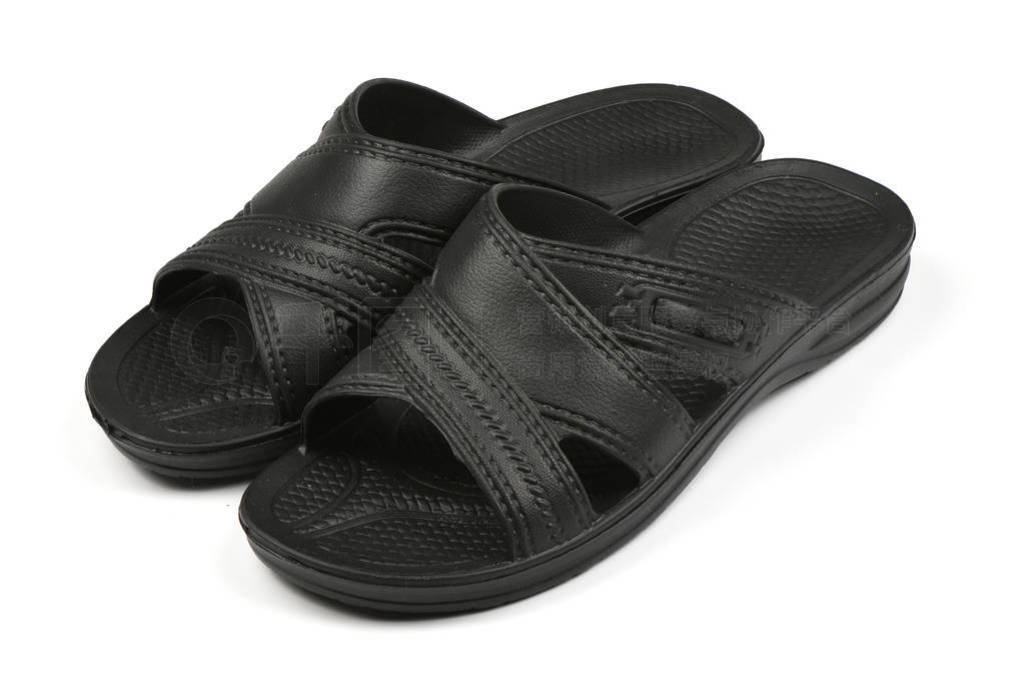 Rubber slippers. Pair of black flip flops isolated on a white.