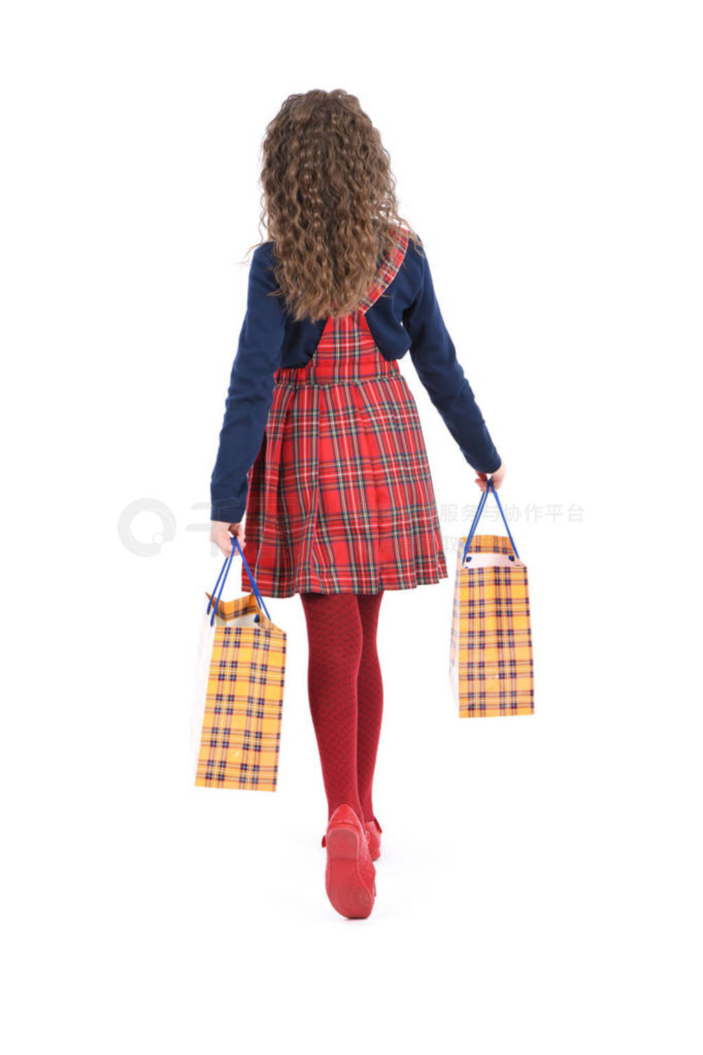 Child with a yellow packaging checkered texture isolated on whi
