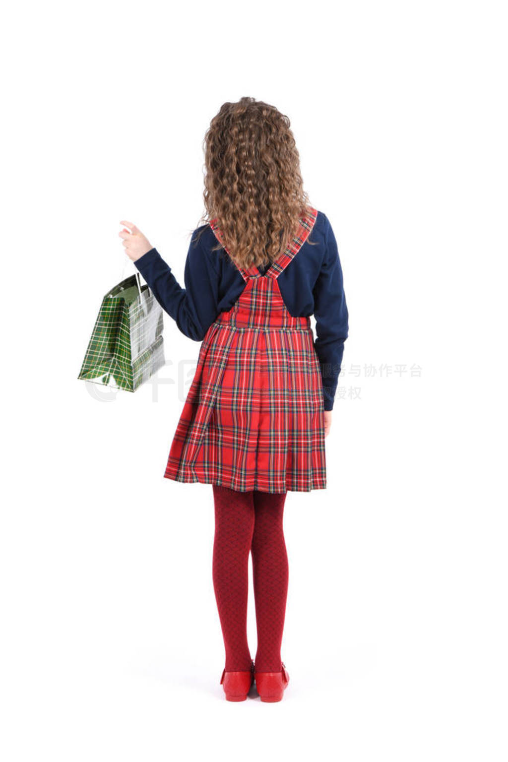 Child with a green packaging checkered texture isolated on white