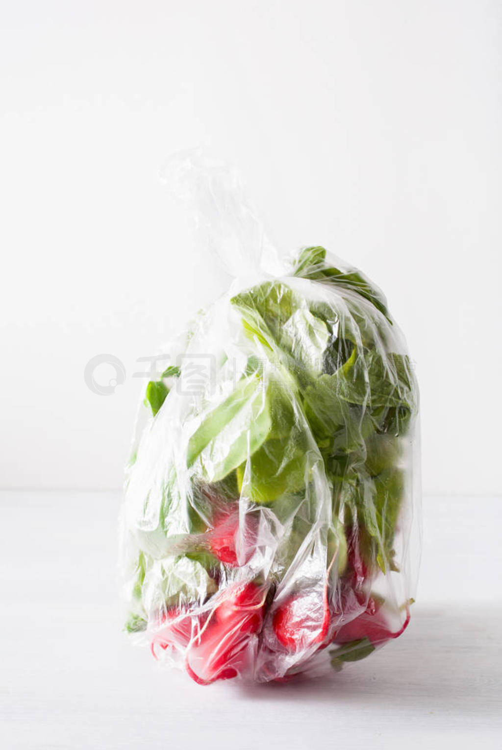 single use plastic packaging issue. radish vegetable in plastic