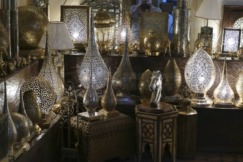 Filigree metal lamps in a shop in the medina