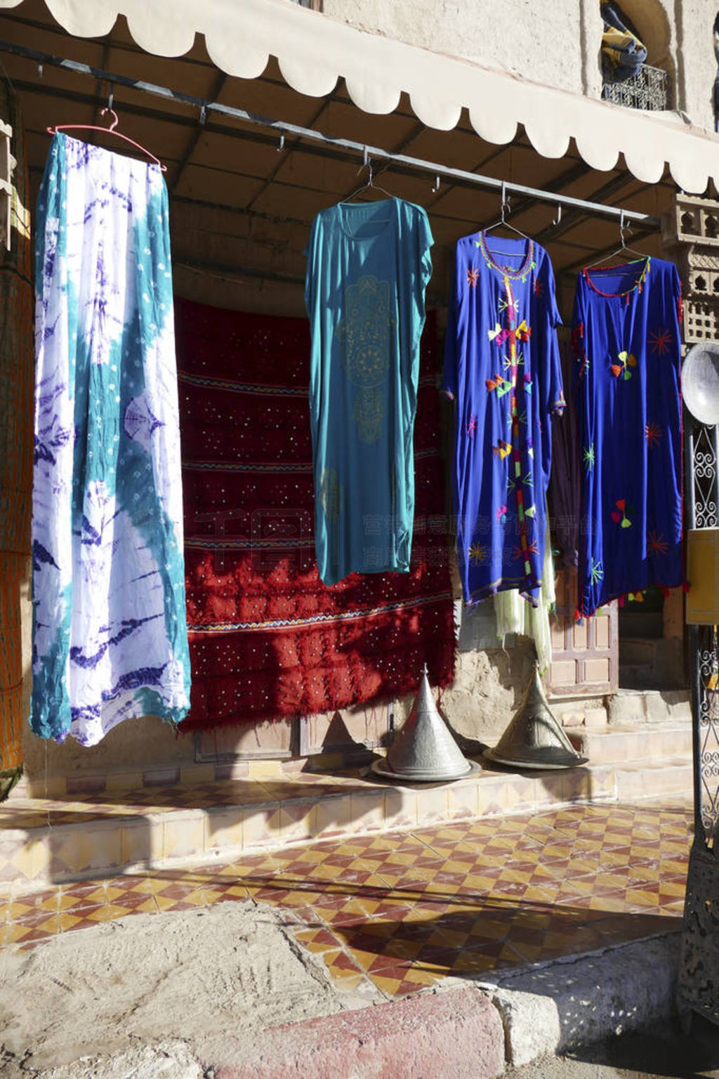 Traditional Berber dresses outside a store