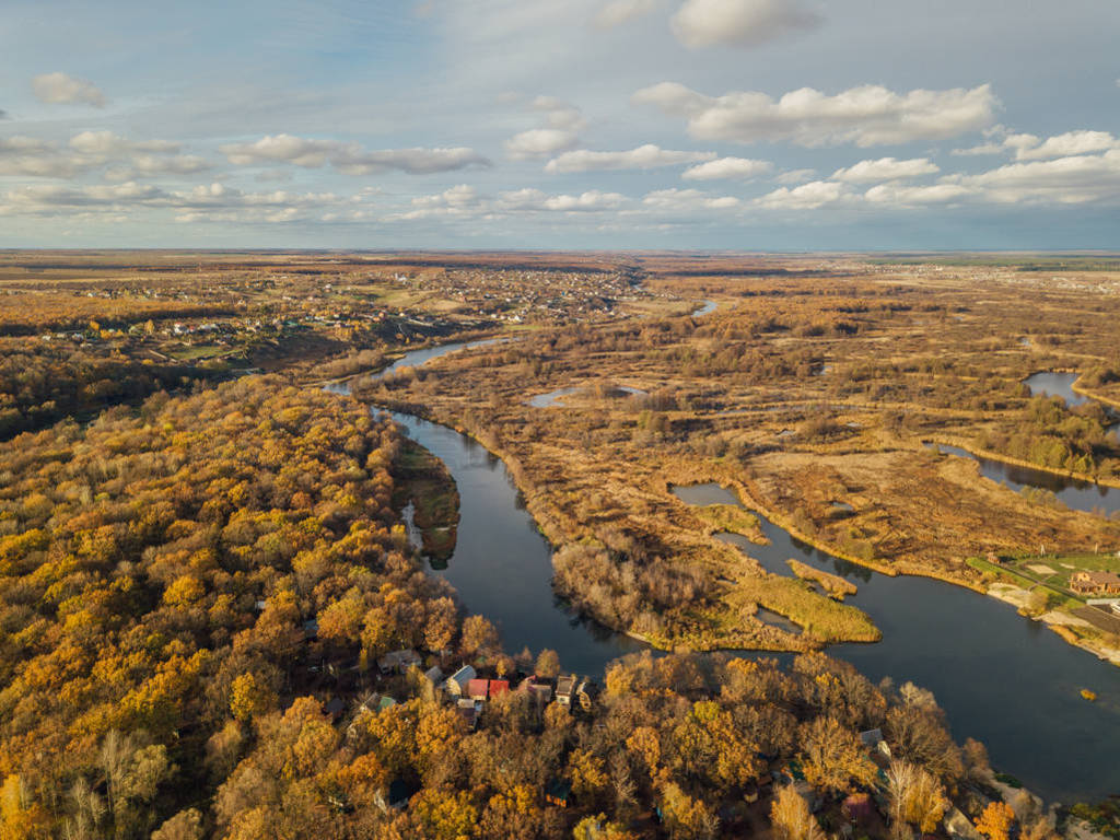 Aerial view of rural landscape in autumn. Small village houses,