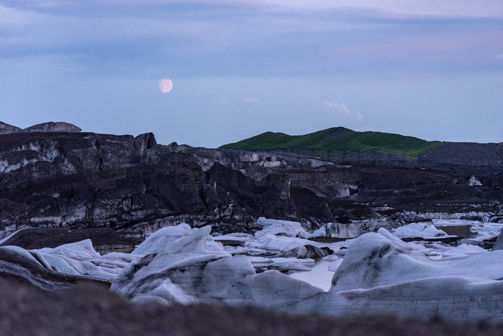 Beautiful night, Icelandic landscape with Glacier, ash and moon
