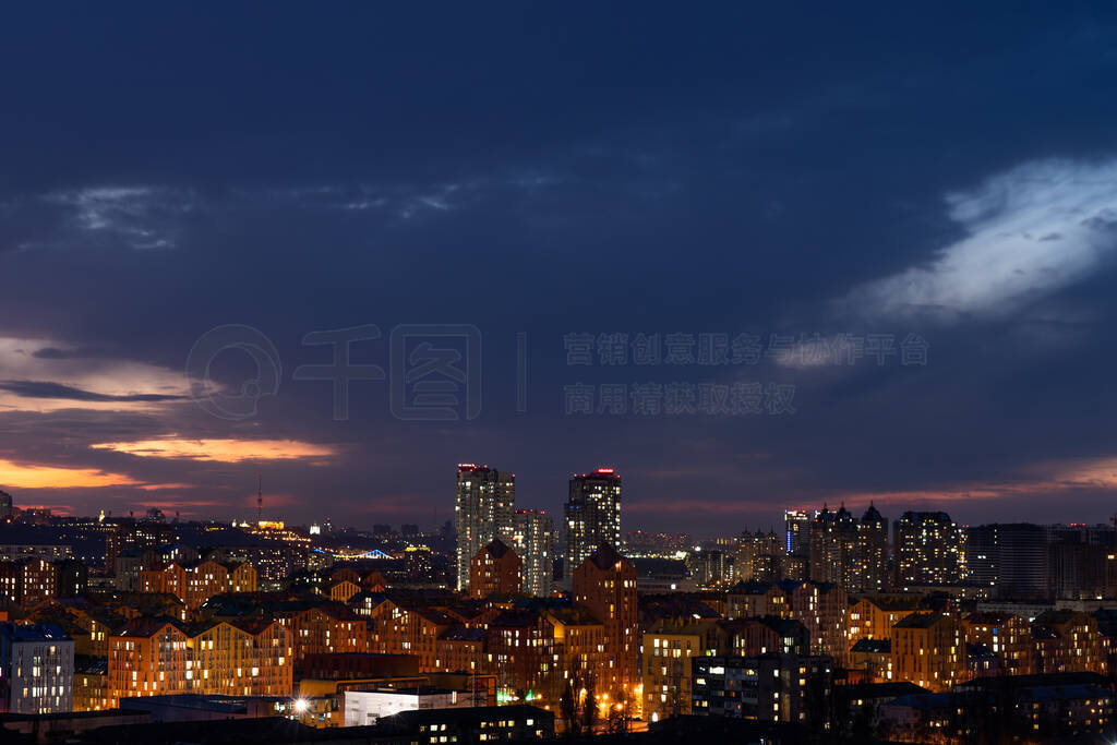 Aerial shot of colorful residential buildings during sunset. Rea