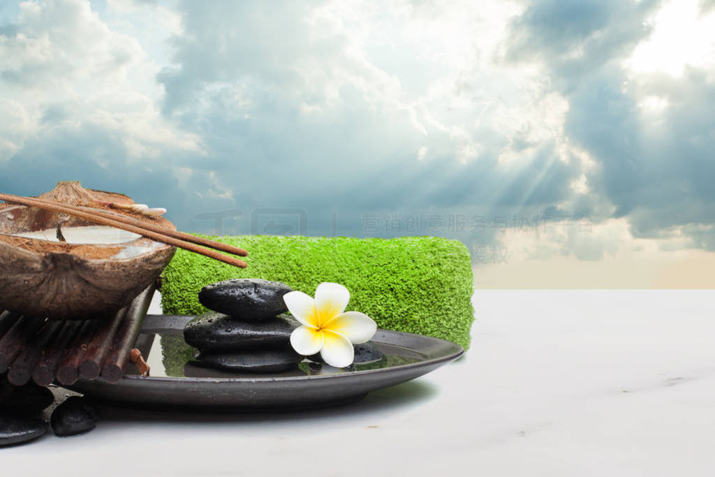 spa objects with candle, stones and flower for relax therapy.