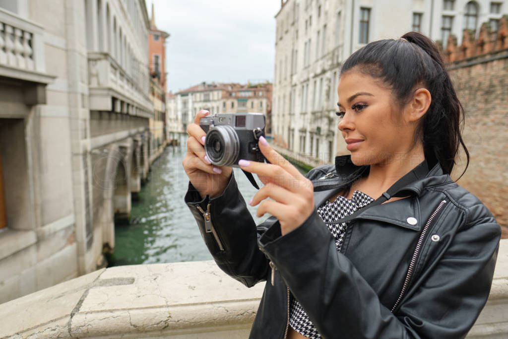 Smiling woman Tourist Takes Photos In Italy