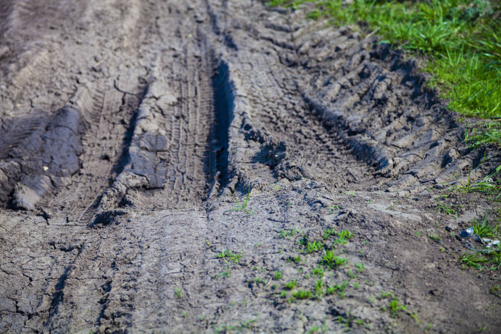 Dirty road in the countryside close up.