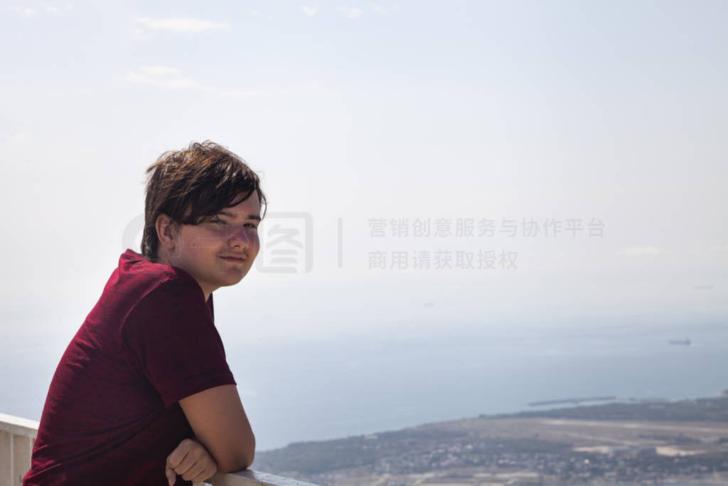 Young man stands on the observation deck