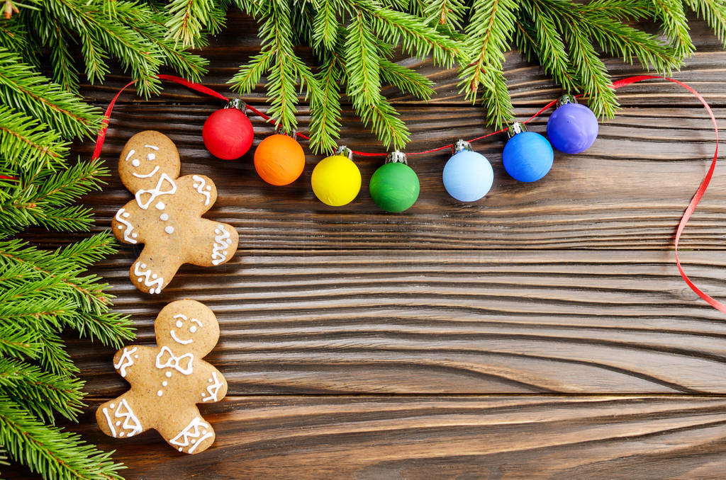 Christmas background of gingerbread cookies spruce branches and
