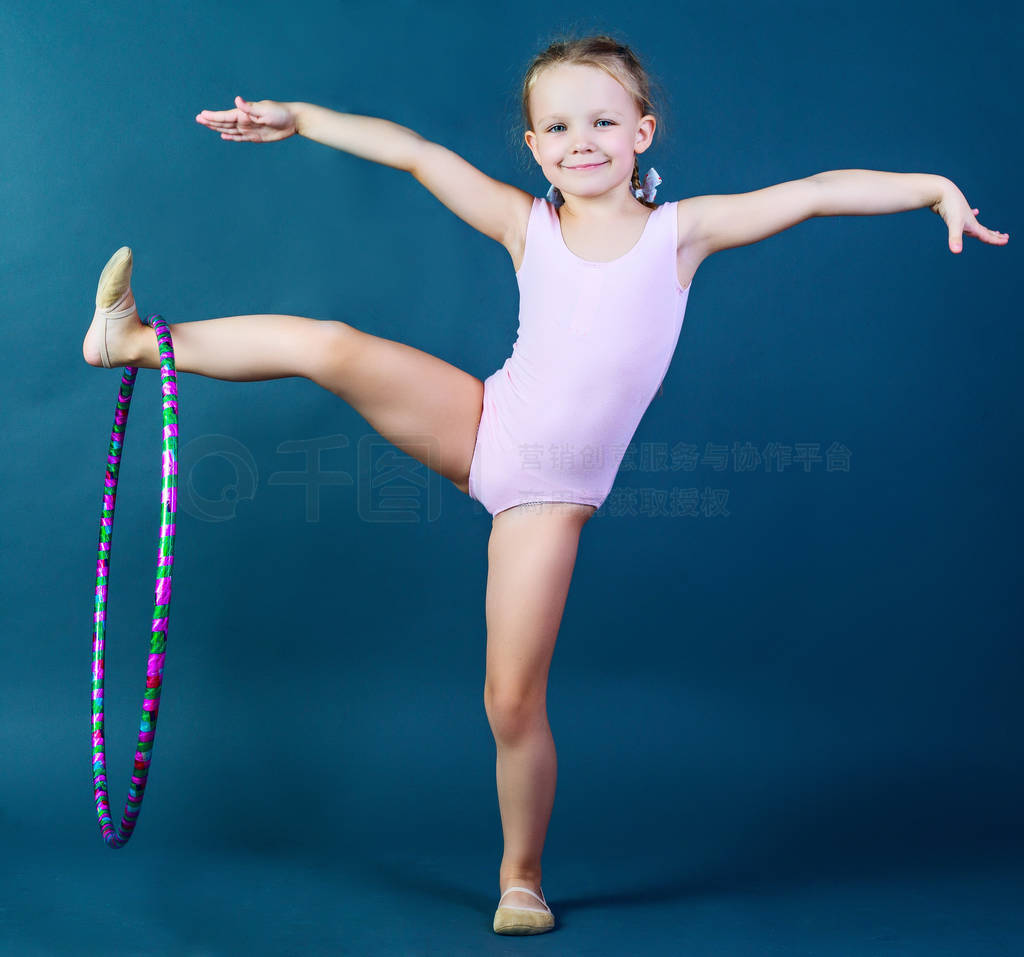 cute girl gymnast with a hoop