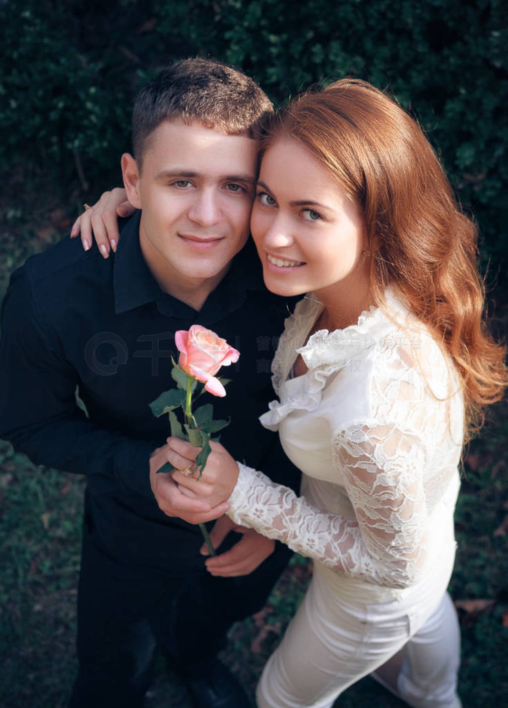 Love and affection between a young couple at the park