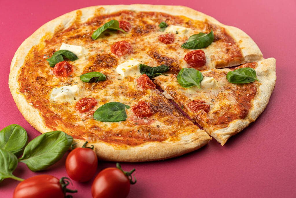 pizza close-up, isolated, against a colored background. whole pi