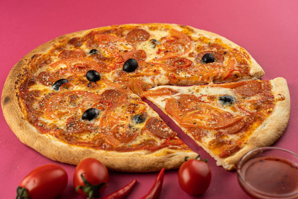 pizza close-up, isolated, against a colored background. whole pi