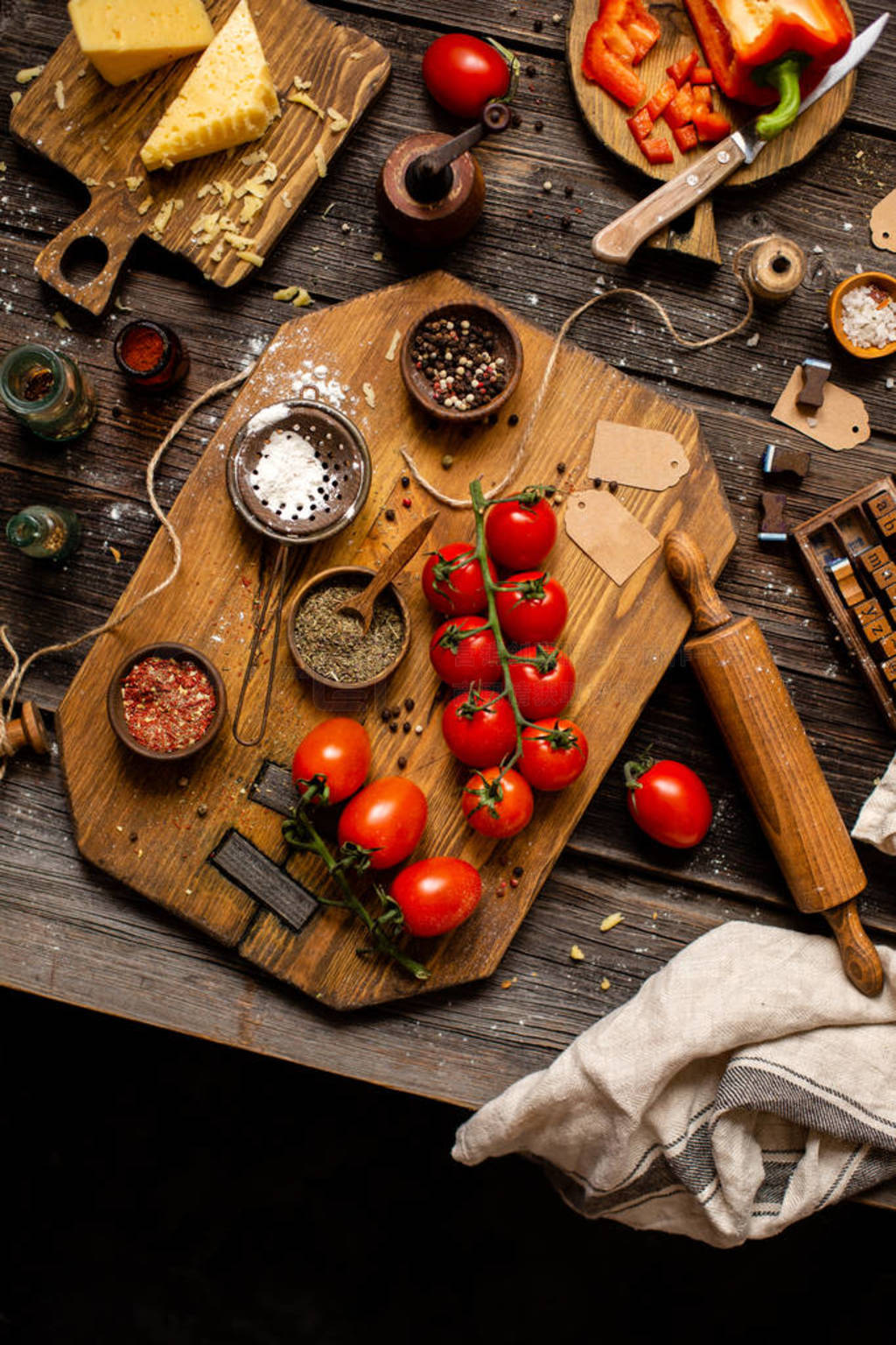 Overhead shot of branch ripe cherry tomatoes on wooden board