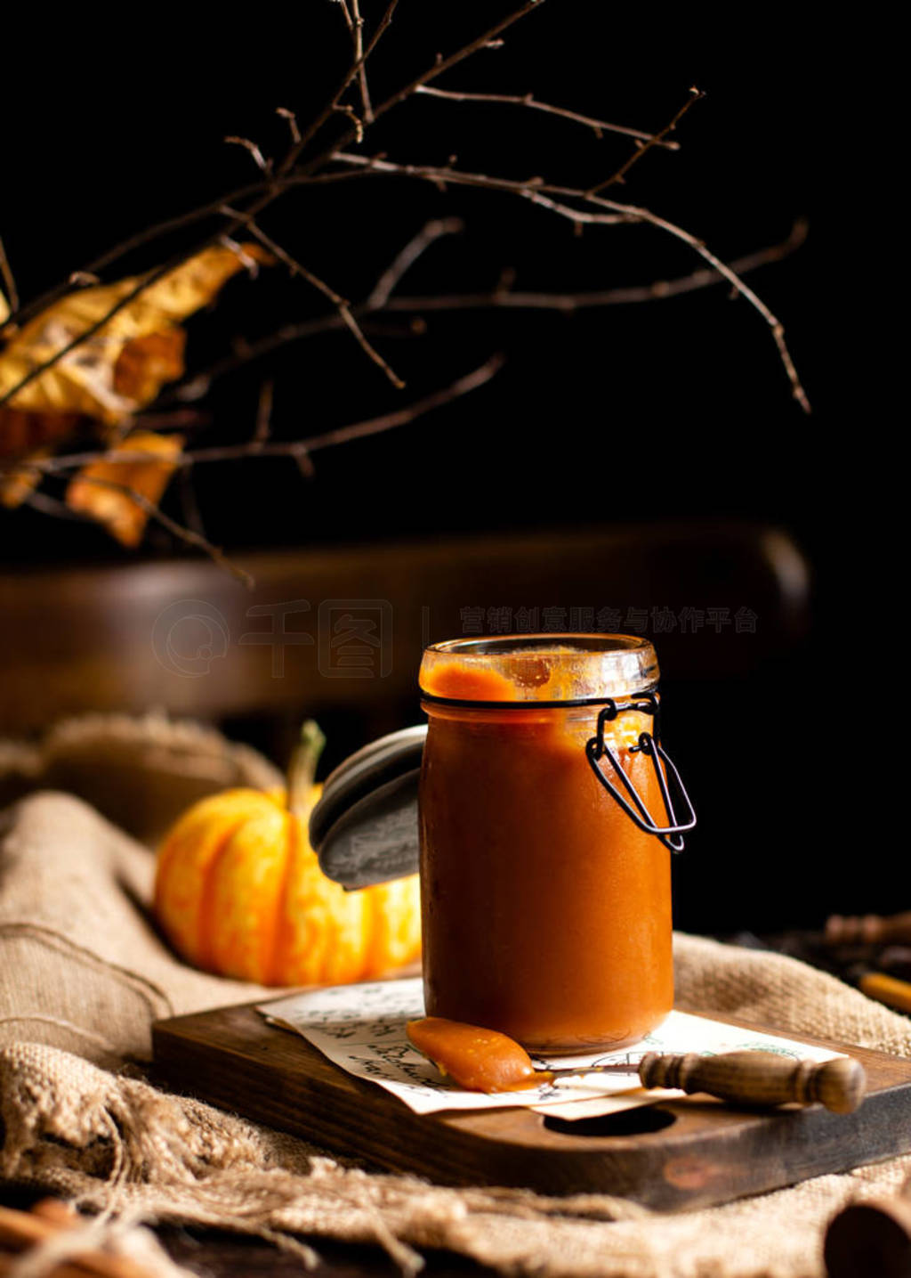 homemade sweet and tasty pumpkin caramel n glass jar stands on w
