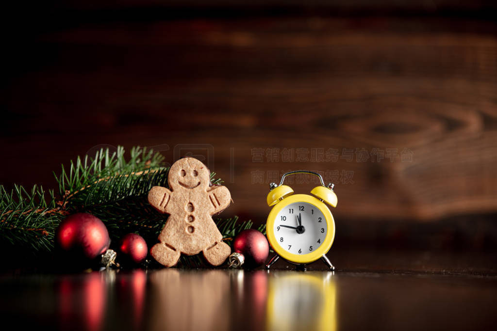 Vintage alarm clock and Christmas decoration with cookie