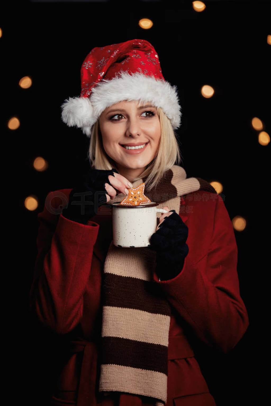 girl with cup of coffee and gingerbread cookie