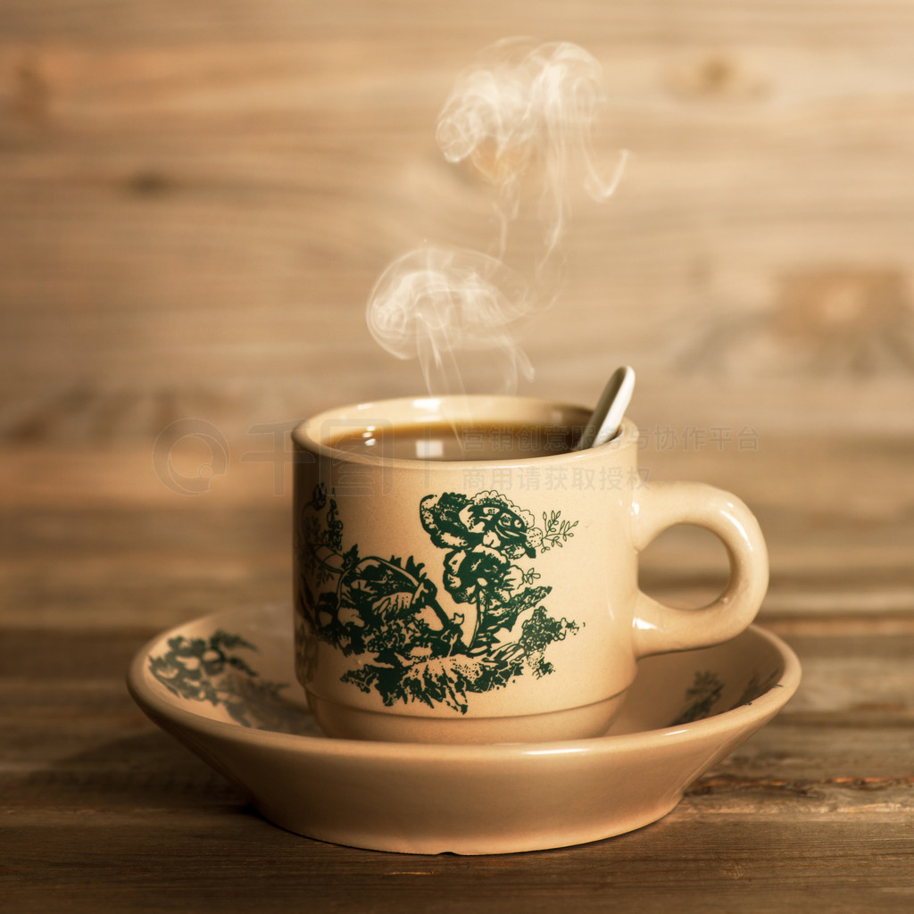 Steaming traditional oriental Chinese coffee in vintage mug and