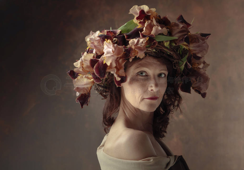 Attractive woman in wreath with brown iris blossoms.