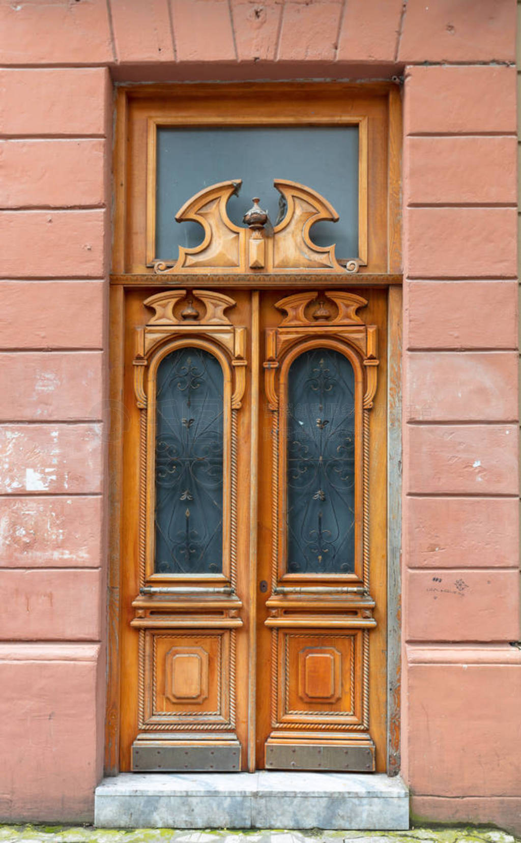 Old wooden door with carved ornaments.