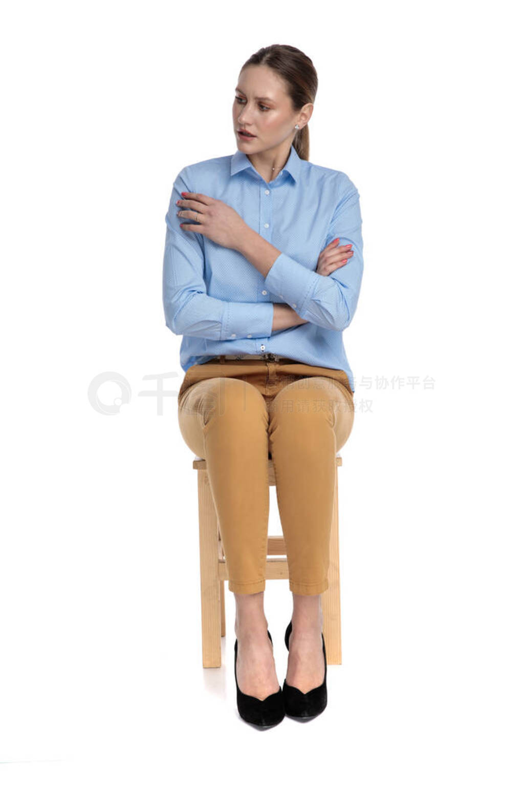 concerned young businesswoman wearing blue shirt