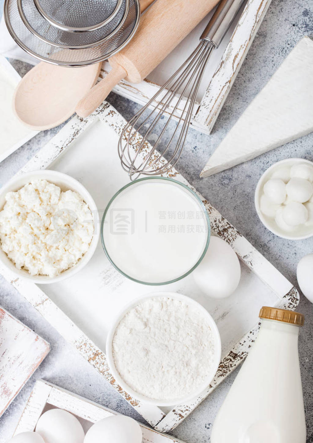 Fresh dairy products on white table background. Glass of milk, b