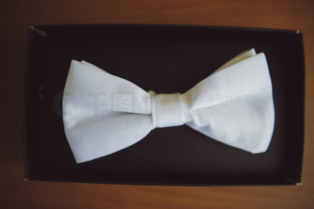Groom's wedding accessories. Bow tie, suit, cufflinks, belt and